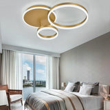 Gold 3-ring LED ceiling light with two large rings and one smaller ring