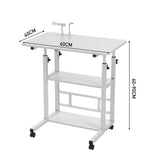 White height-adjustable overbed table with caster wheels; 60cm by 40cm top