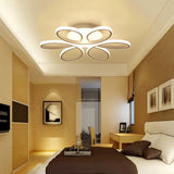 Five-petal modern LED semi-ceiling luminaire with glowing white rings and curved arms