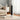 White standing electric heater with dark grille, digital display, and branded base