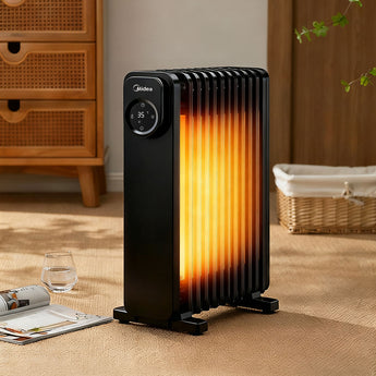 Black 11-fin oil-filled radiator with glowing heat panel, showing front control dial