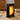 Black 11-fin oil-filled radiator with glowing heat panel, showing front control dial