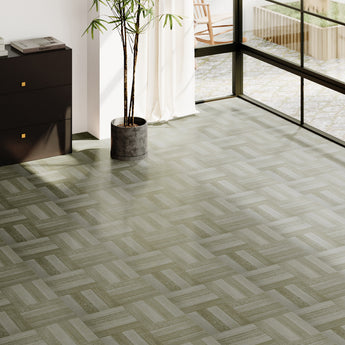 Wood-effect vinyl floor tiles in herringbone pattern, light gray-green tones, peel-and-stick