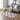 Grey and white geometric shag area rug with repeating quatrefoil pattern