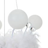 Close view of opal sphere shades and crystal ball connectors on feather pendant light