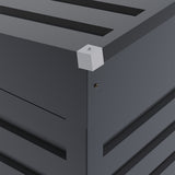 Gray shed corner trim detail with roof edge and wall panel seams