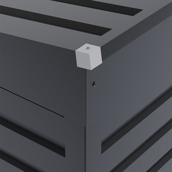 Gray shed corner trim detail with roof edge and wall panel seams