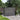 Gray 239.5cm outdoor storage shed with double doors and louvered side panels