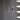 Metal hinge hardware on cabinet door with screw plates and wood grain surface