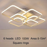 LED ceiling fixture with six square rings and adjustable light heads, white housing