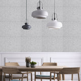 Silvery grey acoustic wall tiles with visible seams for home studio sound control