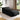 Black 180cm floor lounger with curved backrest and padded, rounded side ends