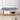 Bamboo shoe bench with gray cushioned seat, lower shelf with basket and shoes