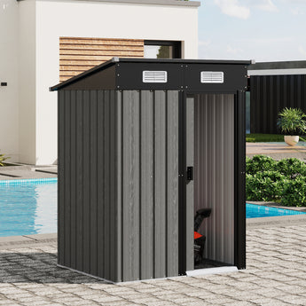Grey metal garden storage shed with sliding door partially open, showing interior
