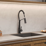 Black kitchen sink faucet with pull-down sprayer and side controls