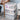 Set of 3 clear folding storage boxes with wheels, stacked with round handle drawers
