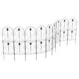 Long run of black metal lawn edging fence panels with arched scrollwork and finials