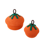 Set of orange crocheted pumpkin baskets with green stem details and brown top handles