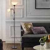 Double-head floor lamp with two fabric shades on a tall black metal pole