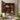 Wall-mounted 3-tier mirror cabinet, dark wood door open, shelves with toiletries and bottles