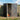 Anthracite metal garden storage shed with doors open showing hanging tool hooks