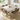 Light wood-grain self-adhesive vinyl flooring plank-style roll in a room setting.
