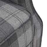 Grey plaid linen upholstery close-up showing woven texture and stitched seams.