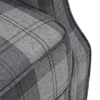 Grey plaid linen upholstery close-up showing woven texture and stitched seams.