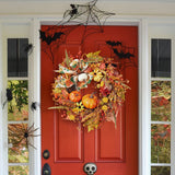 Halloween wreath with pumpkins, autumn leaves, and hanging orange beads