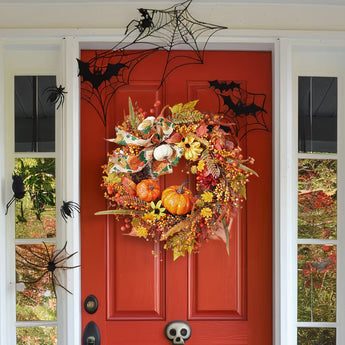Halloween wreath with pumpkins, autumn leaves, and hanging orange beads