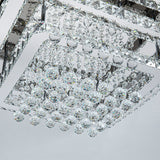 Crystal ceiling lamp detail: faceted prisms and clear round crystal drops