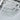 Crystal ceiling lamp detail: faceted prisms and clear round crystal drops