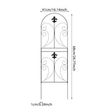 Black metal garden fence panel with arched scrollwork and fleur-de-lis accents