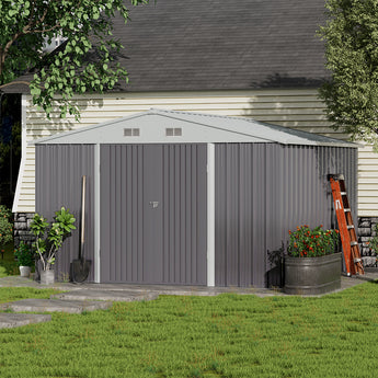 Grey metal storage shed with apex roof and closed double doors