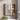 Wall mounted bathroom mirror cabinet in wood grain with mirror door and countertop shelves