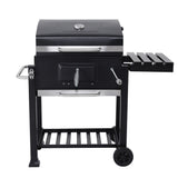 Black charcoal BBQ grill front with side shelf, control area, and open lid