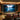 4:3 manual pull-down projection screen in a home theater, white surface with black trim