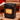 Black portable electric heater with front heating grid and caster wheels