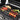 5-burner outdoor gas grill with side burner, stainless grates and lit food on top
