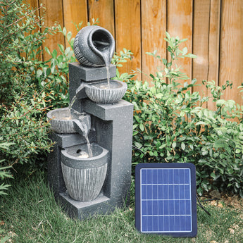 Cascading water fountain feature with four ribbed bowls and arched spout, solar panel