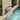 40cm back-entry stainless steel water blade spout with water flowing into pool