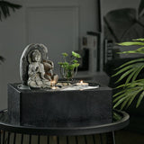 Buddha Zen Tischbrunnen auf rundem Untersetzer mit Teelicht und Springbrunnen-Skulptur