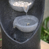 Middle bowls with waterfall stream on dark speckled 4-tier garden fountain