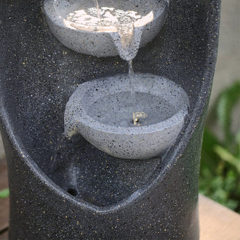 Middle bowls with waterfall stream on dark speckled 4-tier garden fountain