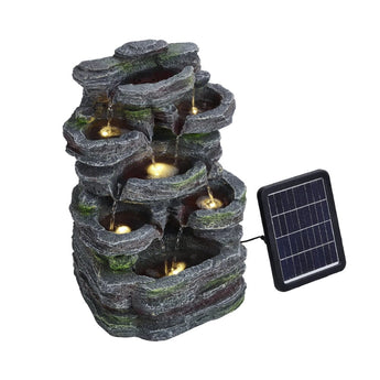 Faux rock garden fountain with lights, glowing light points in recessed stone basins.