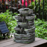 Faux rock garden fountain with integrated solar lights and fountain water streams.