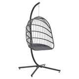 Black rattan patio swing chair with seat cushion and hanging chain, side view