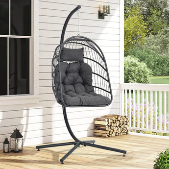 Black rattan patio swing chair with stand and dark gray seat cushion