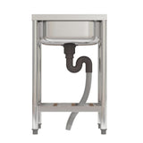 Stainless sink underside: drain outlet, U-shaped trap, and flexible hose under shelf.