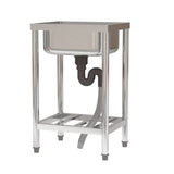 Commercial sink underside with U-shaped trap and flexible hose under the basin.
